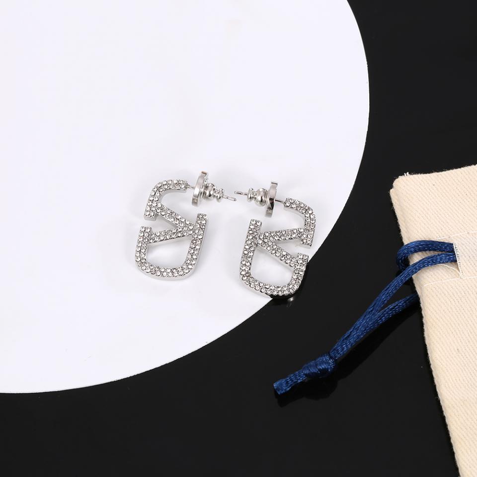 replica,repliche,fake,1:1,earrings,bracelet,ring,jewelry Orecchini a V con logo Valentino